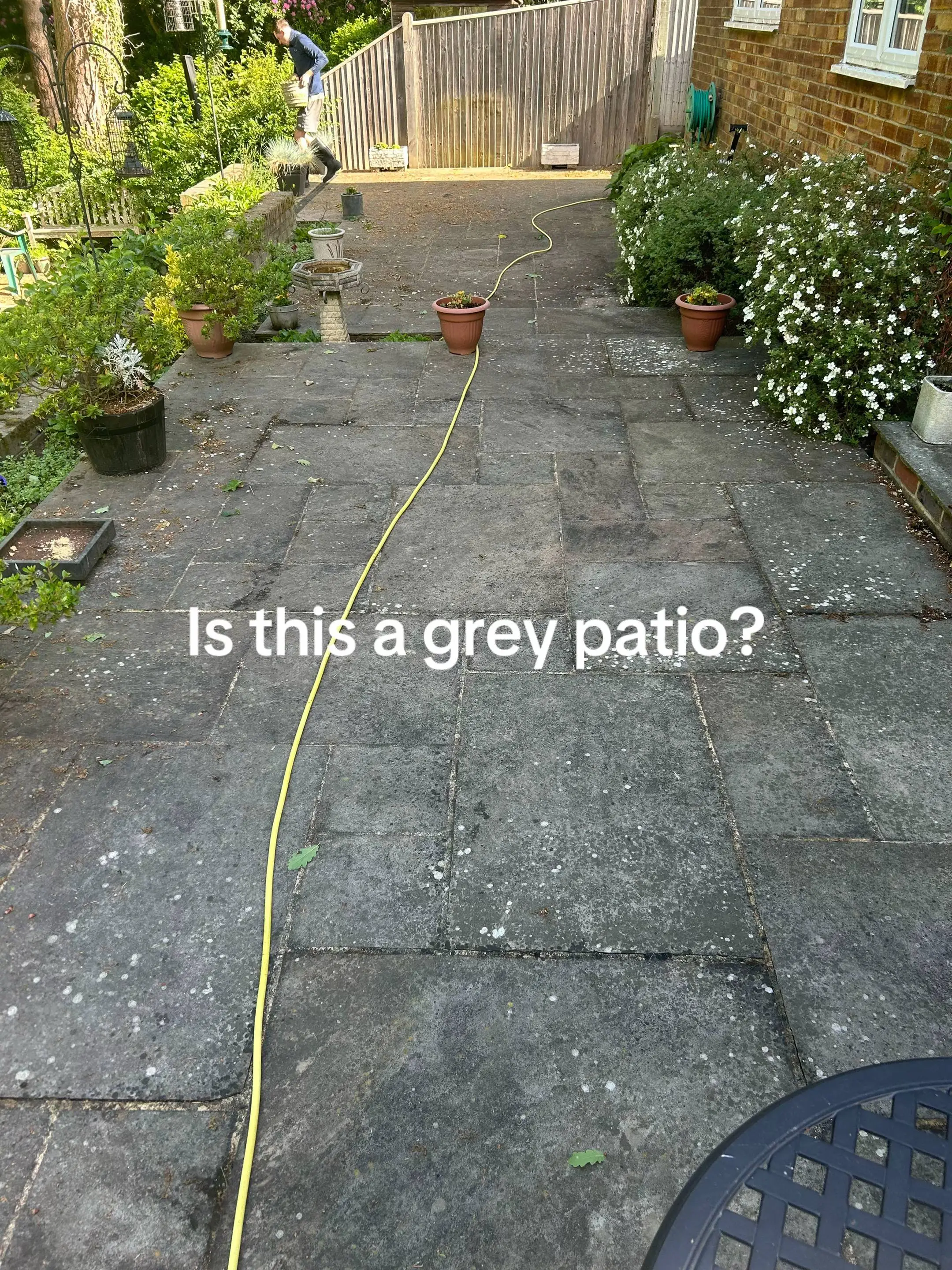 Stained concrete patio before cleaning in Ipswich